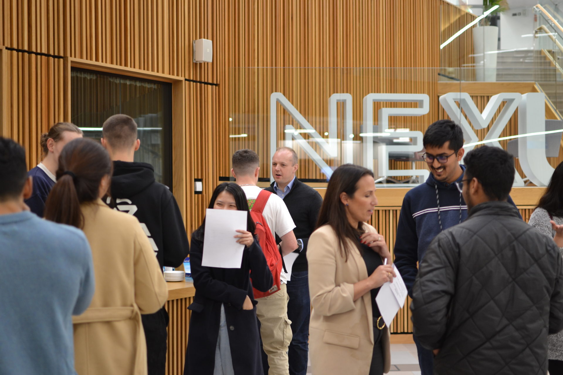Image showing students and staff networking in the Nexus atrium