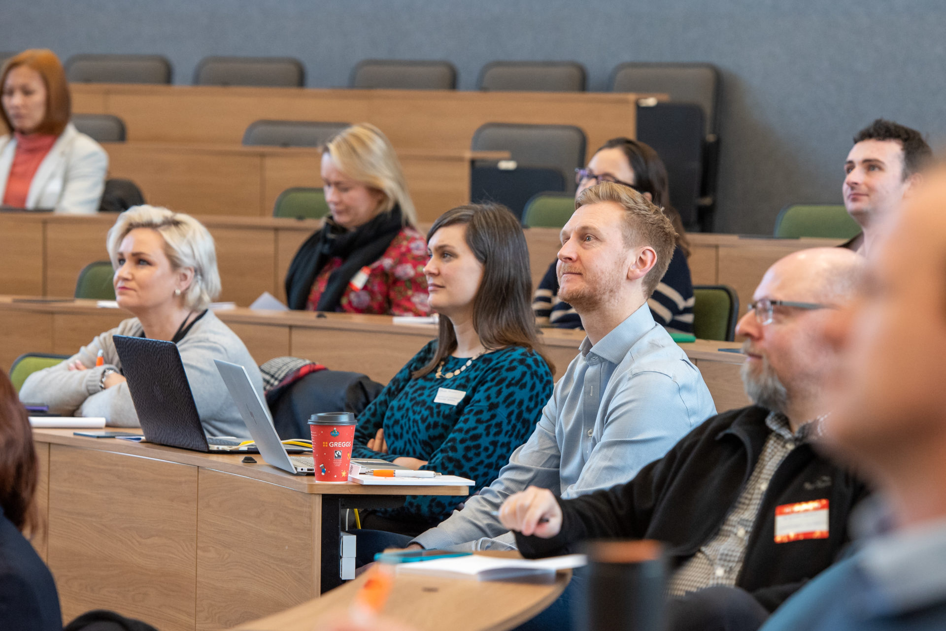 Conference attendees listen to a talk 